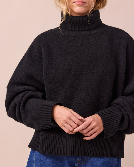 model wears ruth black knitted jumper