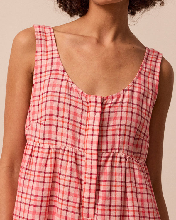 model wears savannah rosewood plaid linen jumpsuit