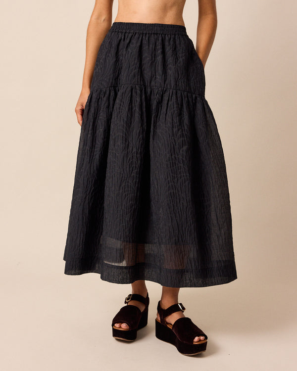 model wears talia black organza skirt