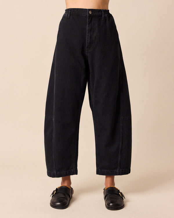 model wears tori washed black denim jeans front