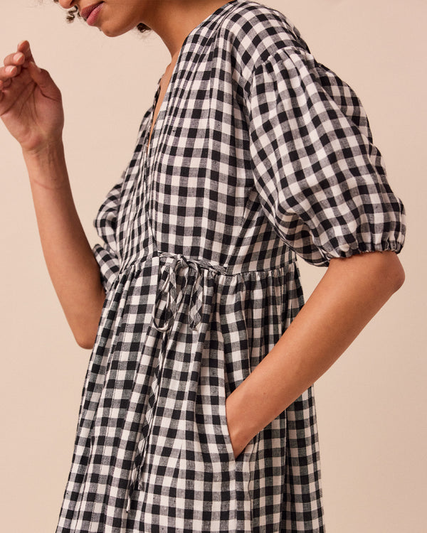 model wears winnie black and white gingham linen dress