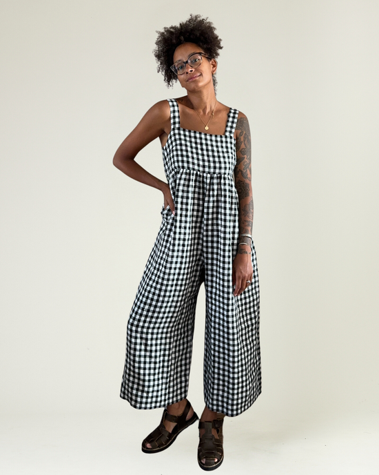 model wears black and white gingham cari jumpsuit