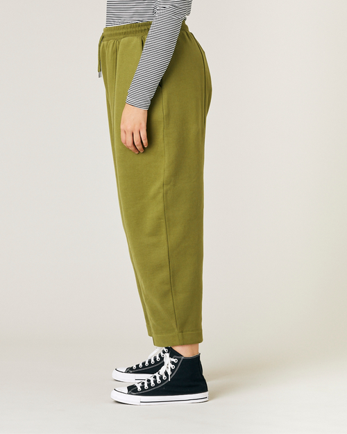 model wears avocado jersey fleece jenny trousers left