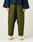 model wears green gingham huxley trousers front