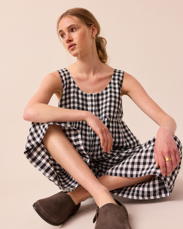 model wears black and white gingham savannah linen jumpsuit