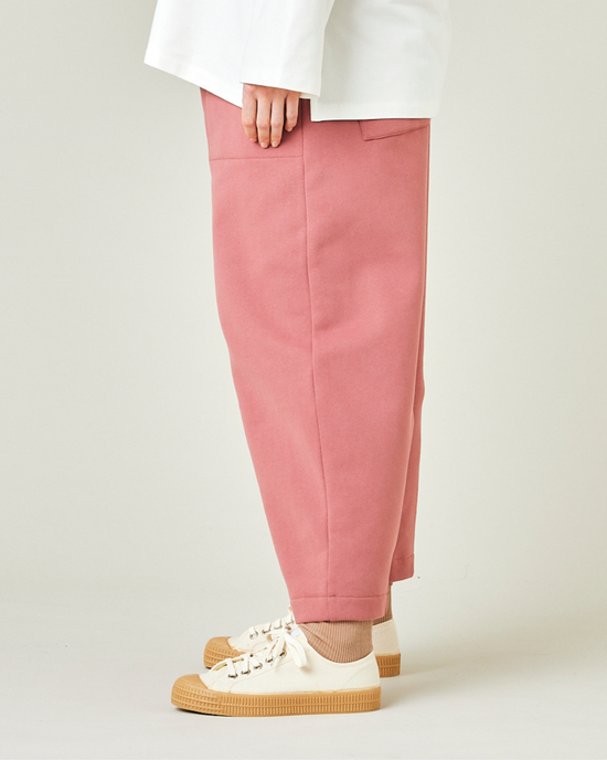 model wears dusty pink jersey huxley trousers left