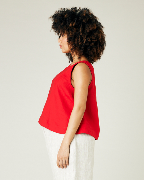 pregnant model wears red linen tara top