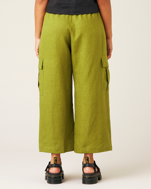 model wears pea pod linen trousers back