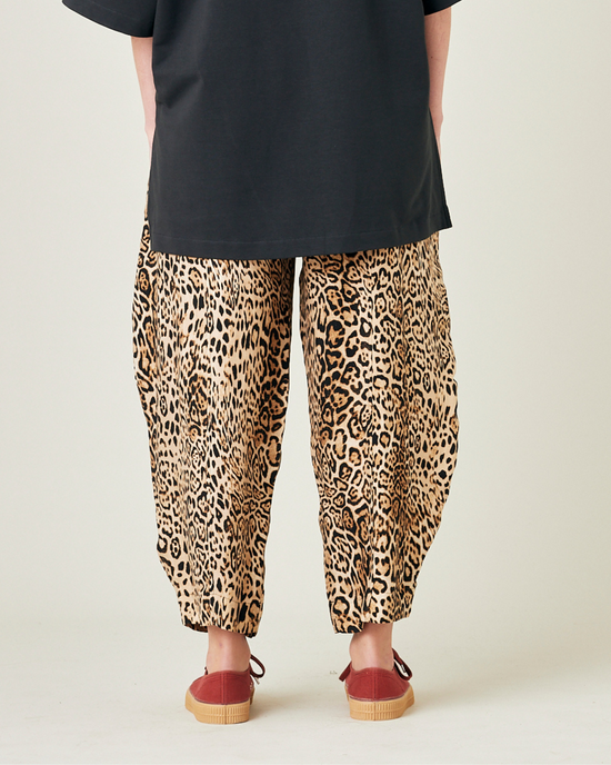 model wears leopard print cupro mabel trousers back