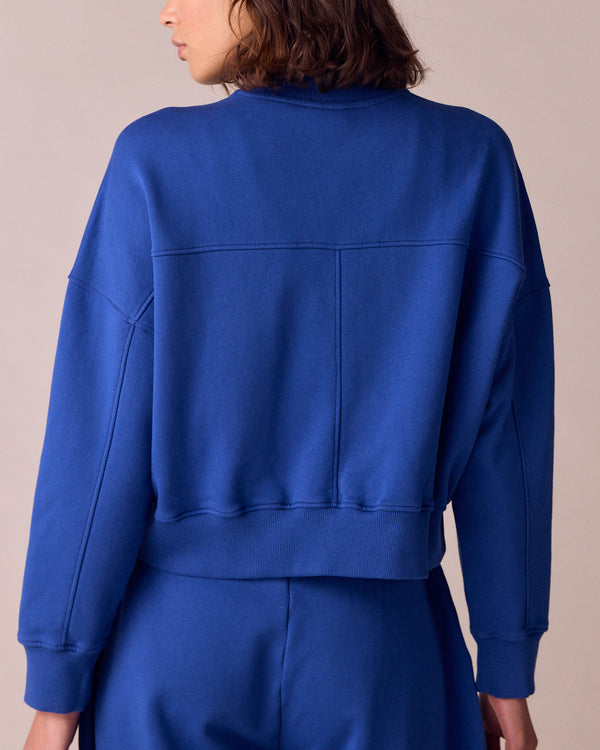 model wears eden cobalt jersey fleeceback jumper