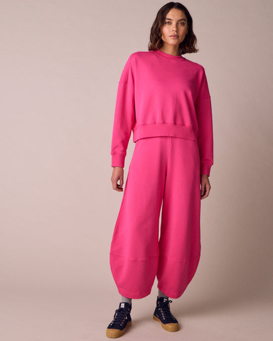 model wears eden hot pink fleeceback jersey jumper