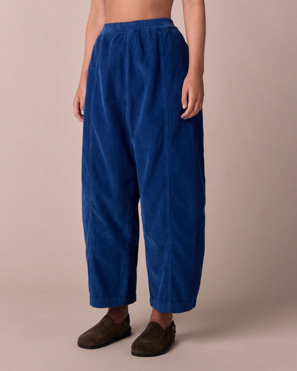model wears mabel lapis blue cord trousers right