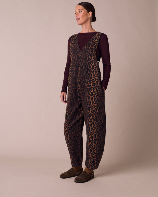 model wears ottie dark leopard denim jumpsuit