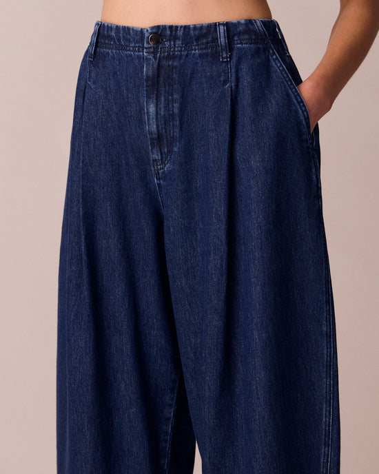 model wears veda dark wash denim jeans