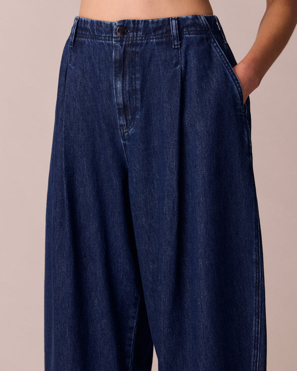 model wears veda dark wash denim jeans