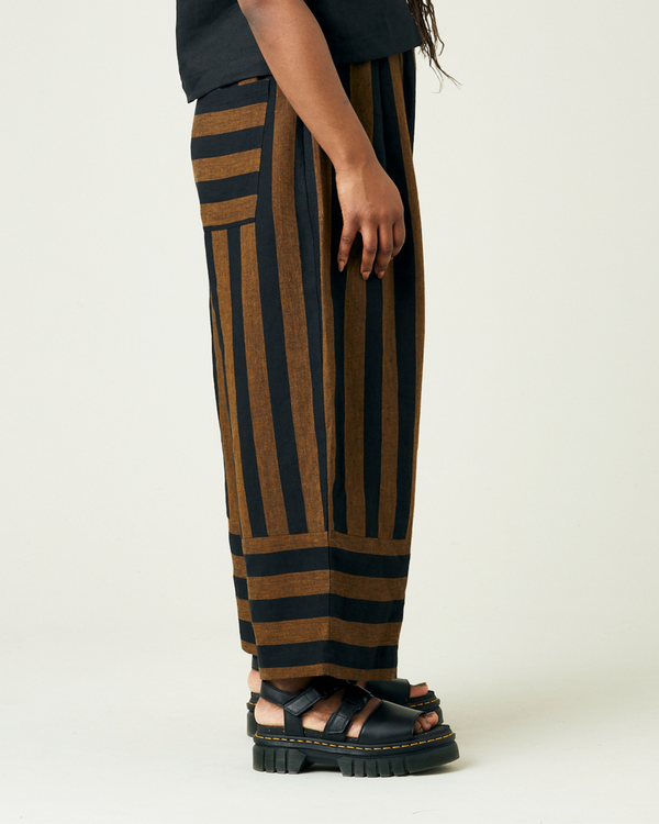 model wears rust stripe bobbi trousers 