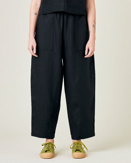 model wears black linen huxley trousers front 