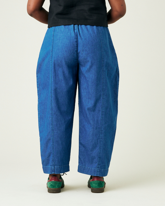 model wears mid wash chambray mabel trousers back