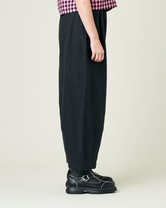 model wears black daisy linen trousers 