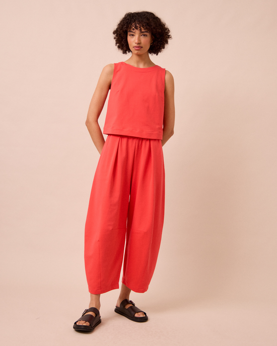 model wears daisy watermelon jersey trousers right