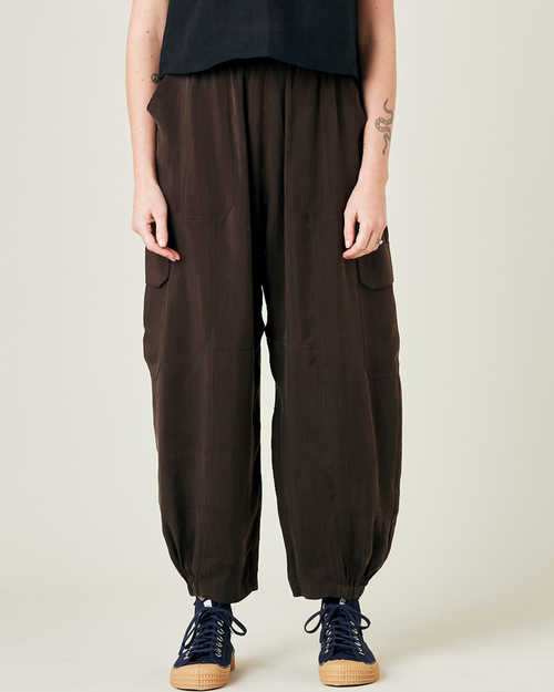 model wears espresso cupro sylvie trousers front