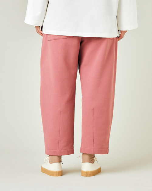 model wears dusty pink jersey huxley trousers back