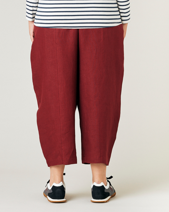 model wears brick linen mabel trousers back