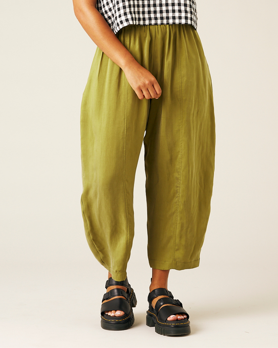 model wears olive cupro mabel trousers front