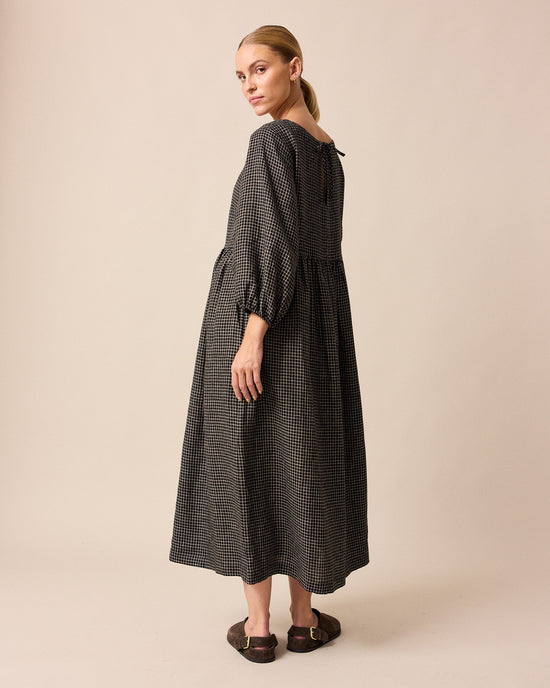 model wears berlin black mini grid linen dress