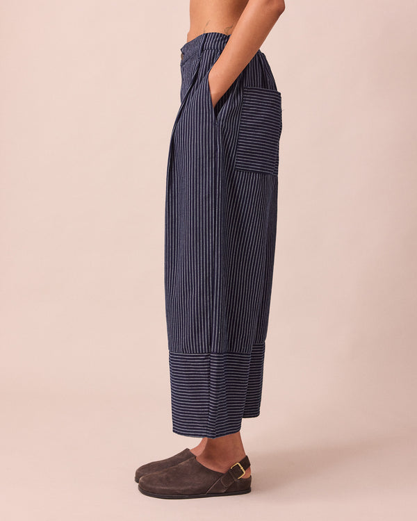 model wears blair navy pinstripe denim jeans left