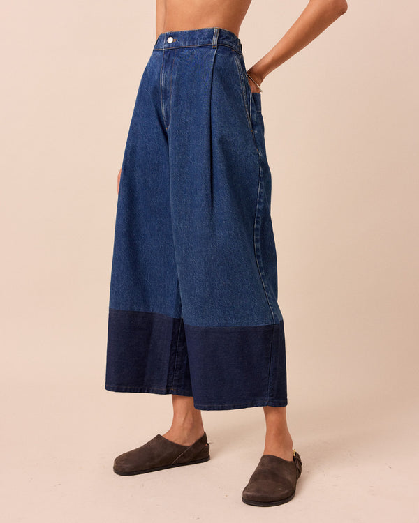 model wears blair mid wash denim jeans left