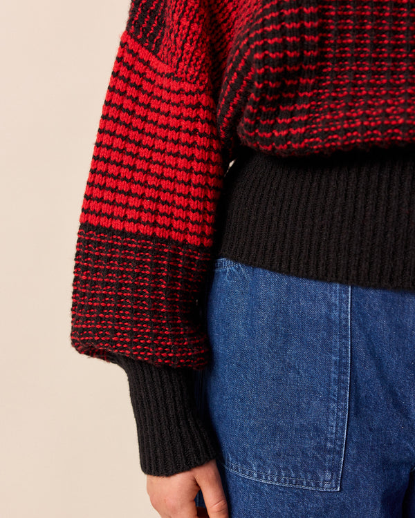 model wears chelsea red and black check knitted jumper
