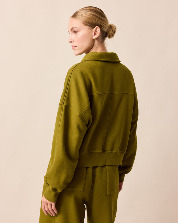 model wears cleo fresh olive jersey jumper