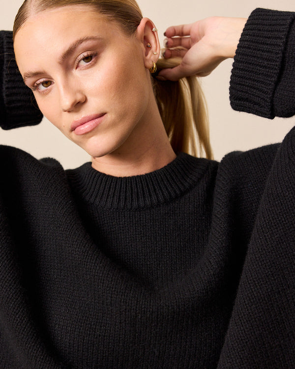 model wears coco black knitted jumper