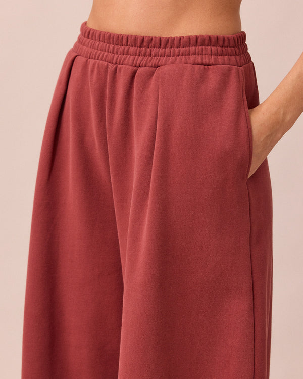 model wears daisy brick fleece jersey trousers