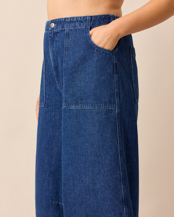 model wears dani mid blue denim jeans