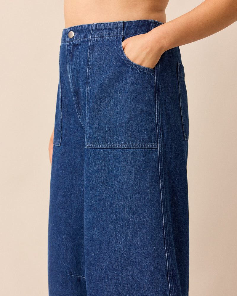 model wears dani mid blue denim jeans