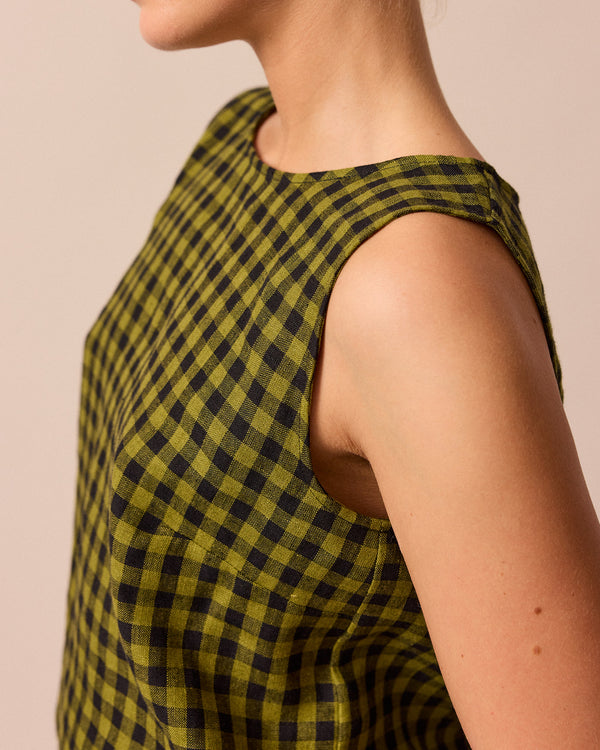 model wears green gingham linen esme top