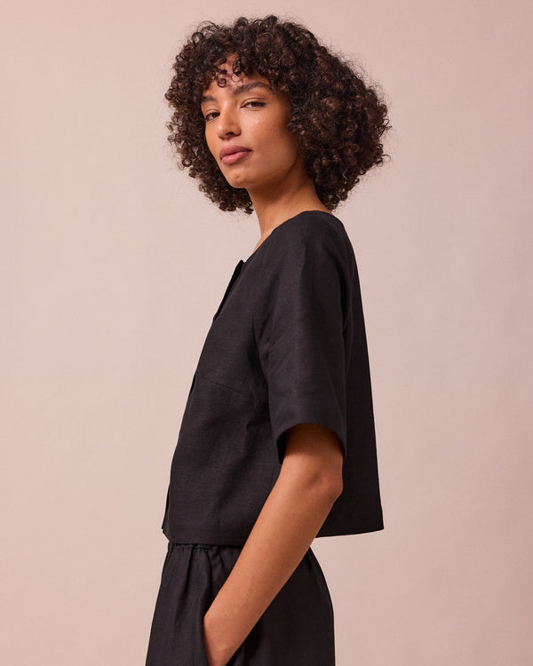 model wears evelyn black linen top
