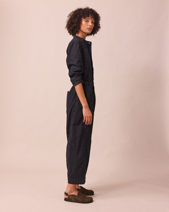 model wears jill black textured cotton jumpsuit