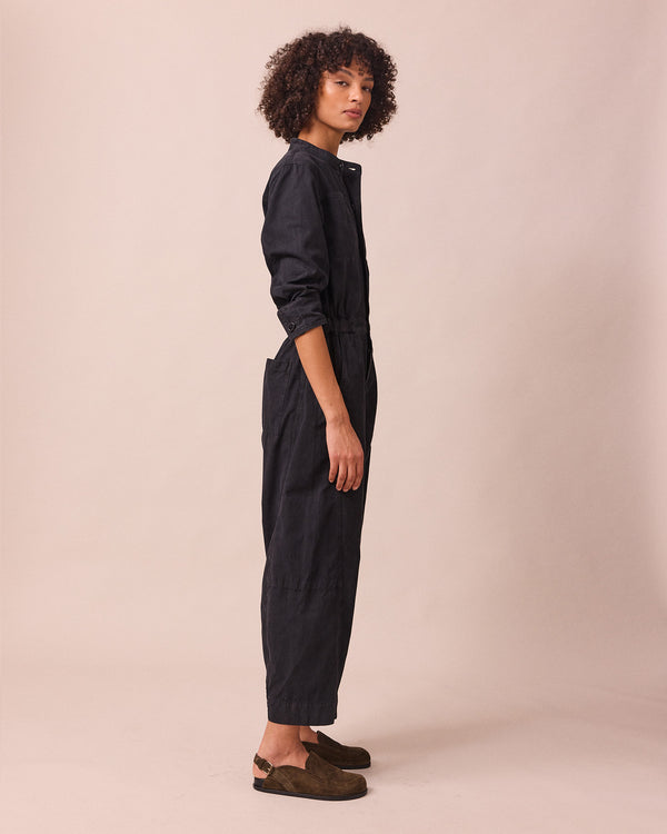 model wears jill black textured cotton jumpsuit
