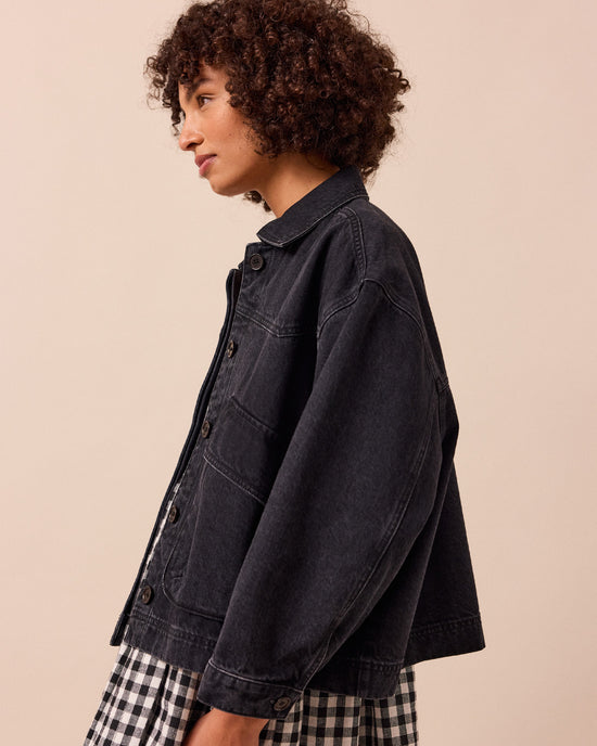 model wears kitty washed black denim jacket