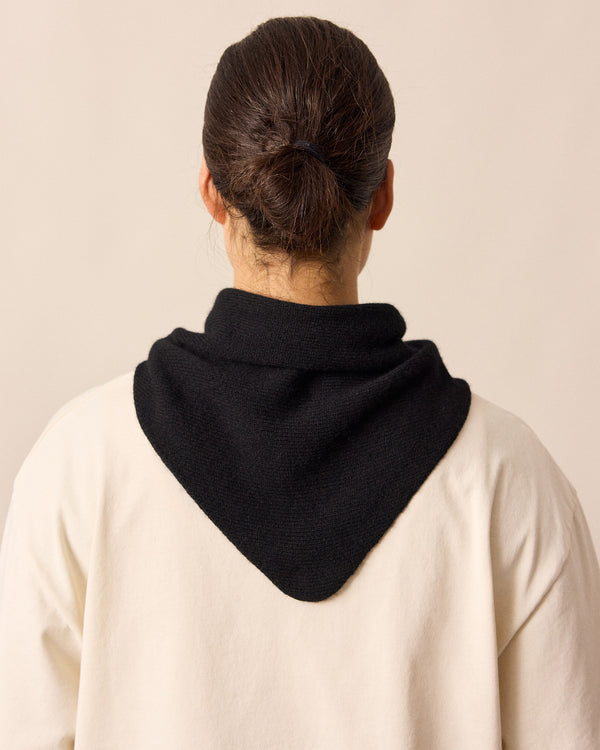 model wears black knitted neckerchief