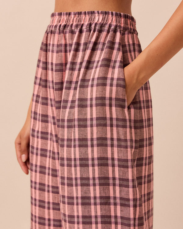 model wears mabel dewberry check linen trousers