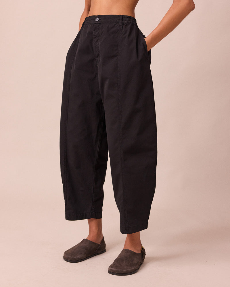 model wears millie black heavy cotton trousers left