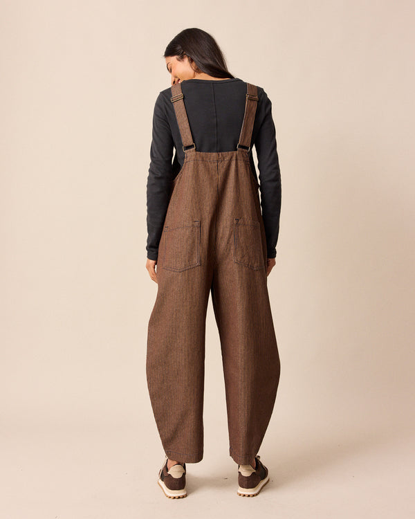 model wear ottie rust hickory stripe denim jumpsuit