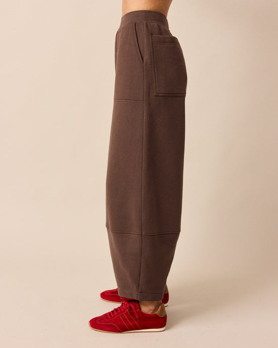 model wears pascale chocolate fleeceback jersey trousers left
