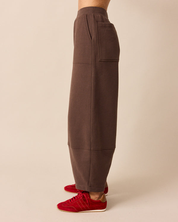 model wears pascale chocolate fleeceback jersey trousers left