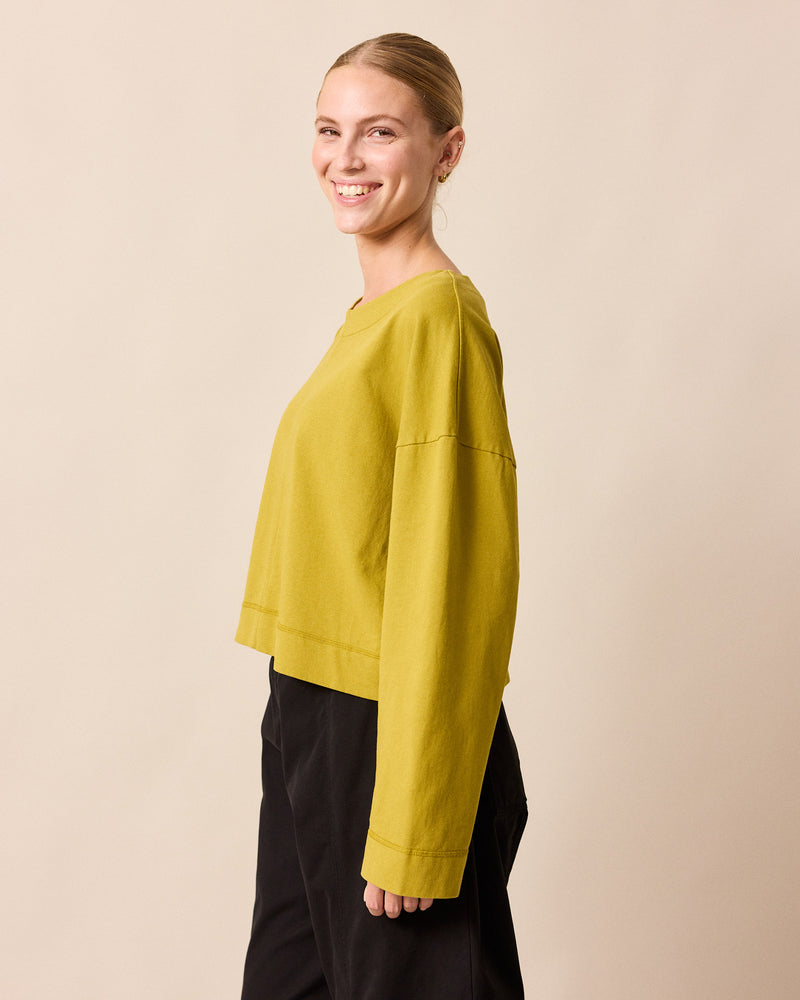 model wears peggy golden pear jersey top