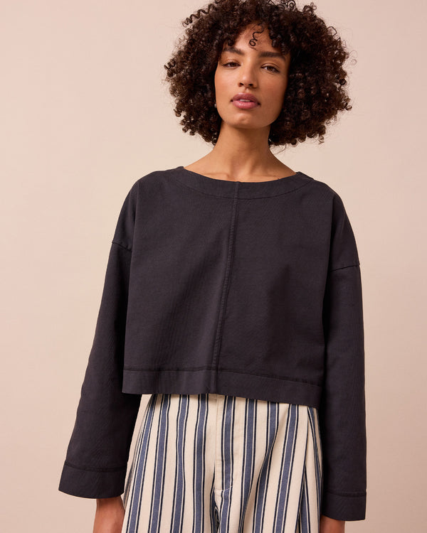 model wears peggy washed black jersey top